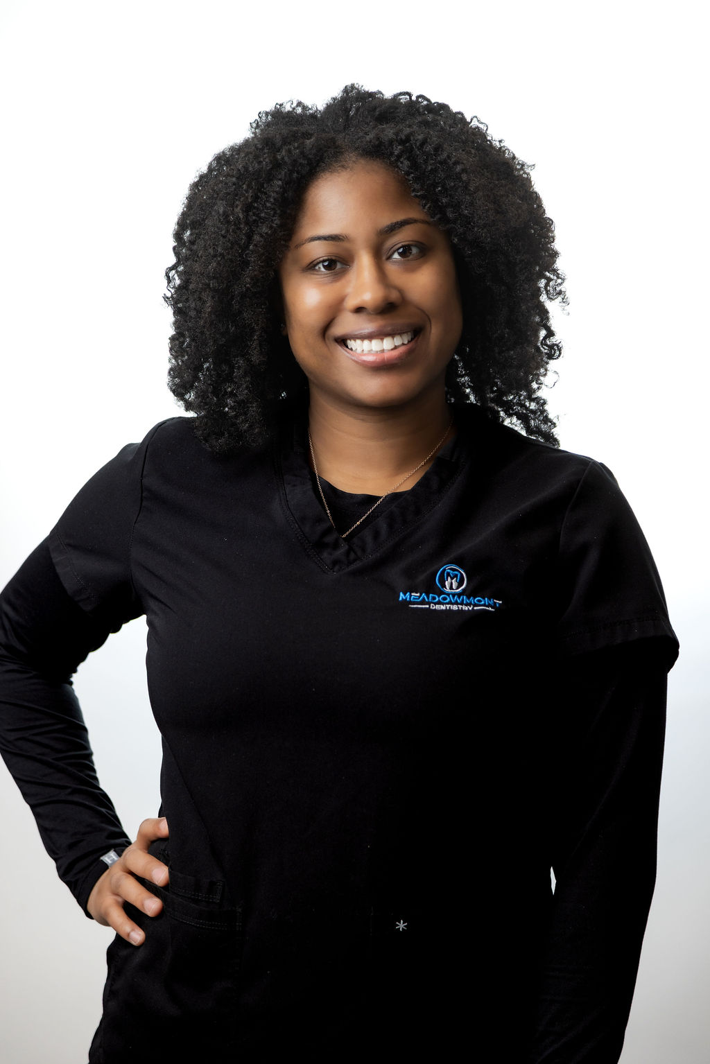 Headshot of a female staff member with a blonde bob in black scrubs — Meadowmont Dentistry in Chapel Hill, NC