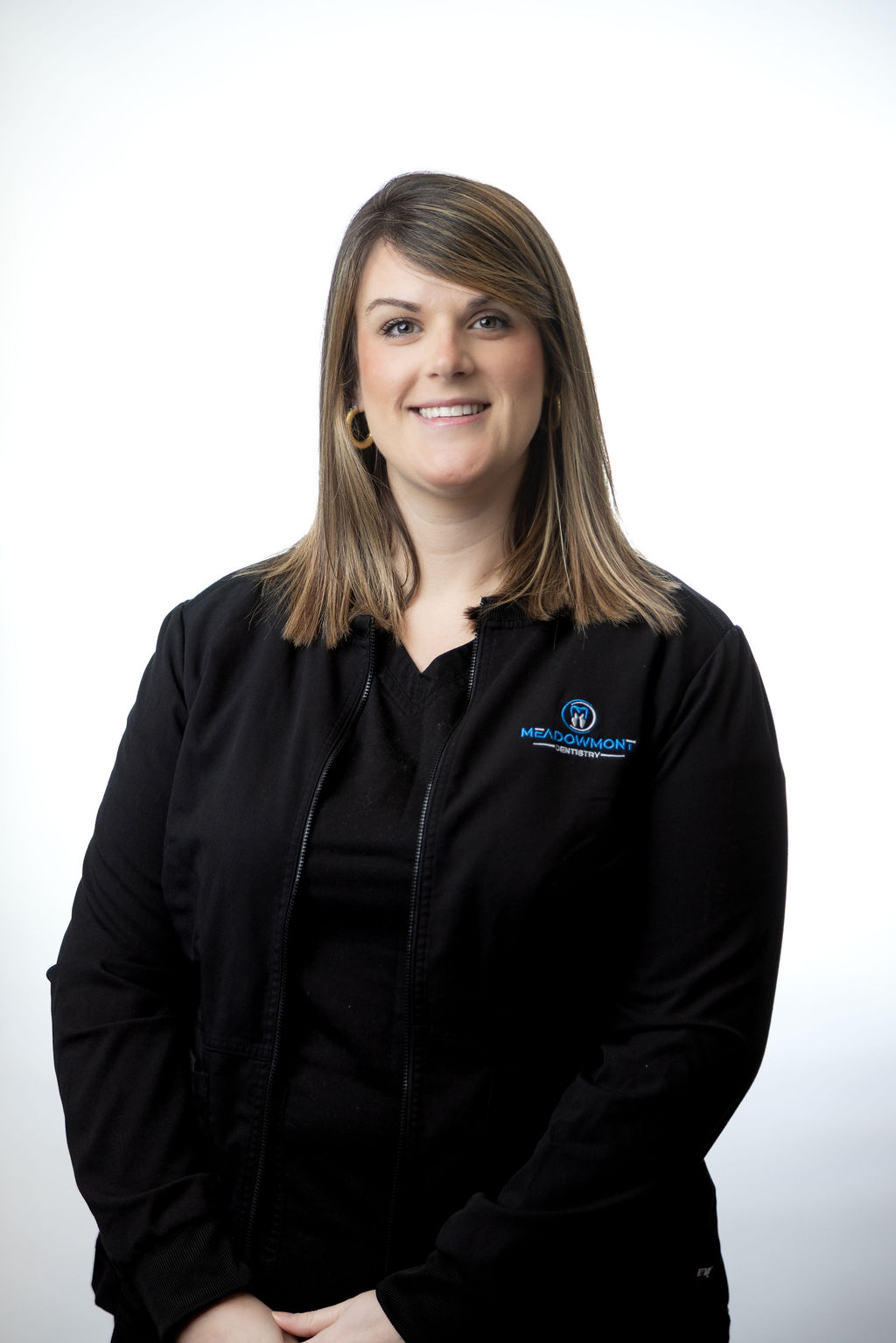 Professional headshot of a female team member in black scrubs — Meadowmont Dentistry in Chapel Hill, NC