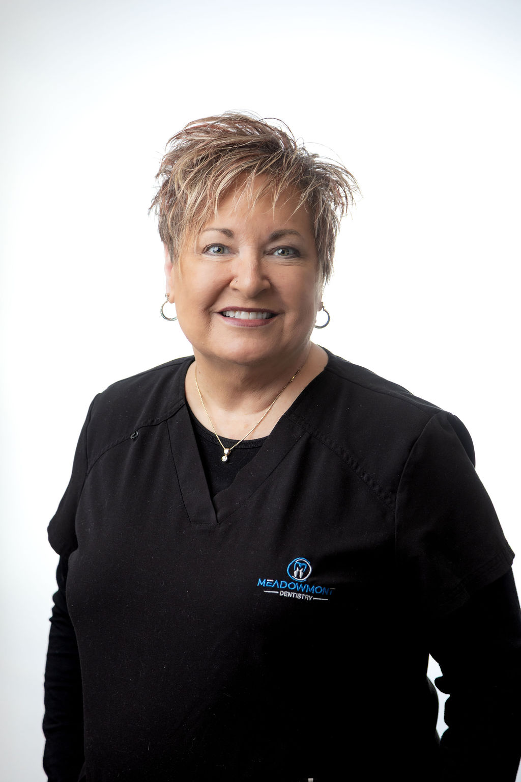 Professional headshot of a female team member in black scrubs — Meadowmont Dentistry in Chapel Hill, NC