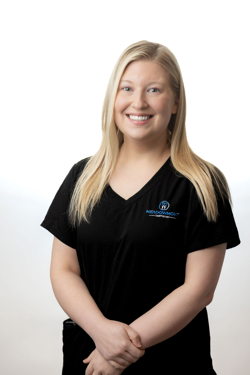 Professional headshot of a female team member in black scrubs — Meadowmont Dentistry in Chapel Hill, NC
