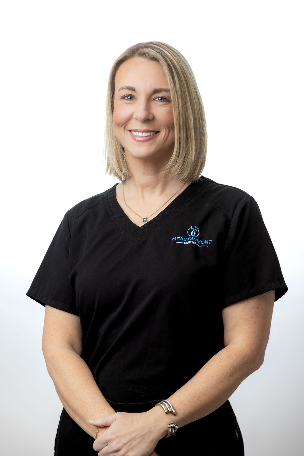Professional headshot of a female team member in black scrubs — Meadowmont Dentistry in Chapel Hill, NC