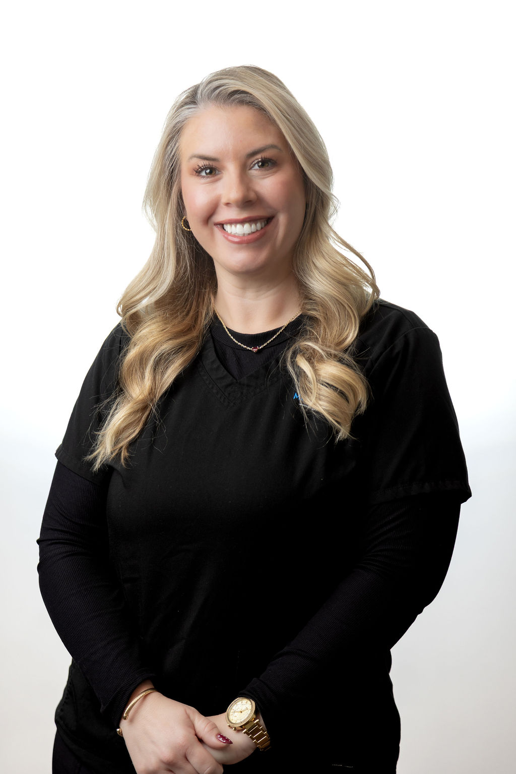 Headshot of a female staff member with a blonde bob in black scrubs — Meadowmont Dentistry in Chapel Hill, NC