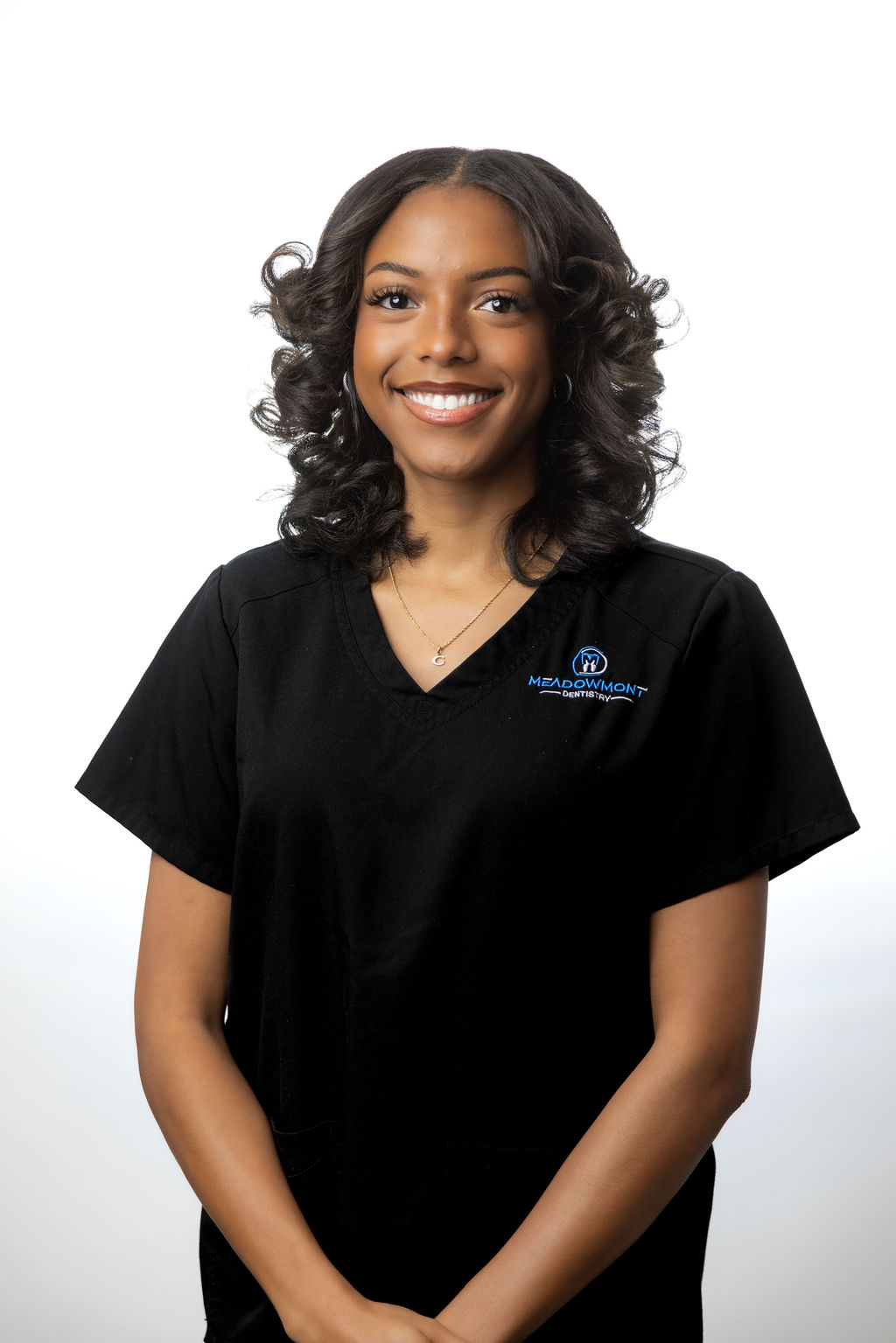 Professional headshot of a female team member in black scrubs — Meadowmont Dentistry in Chapel Hill, NC